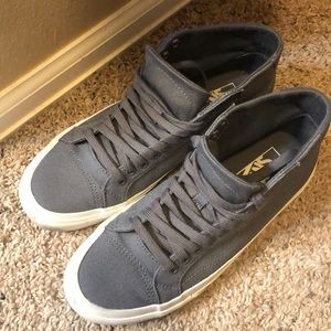 Gray-purple hightop vans.